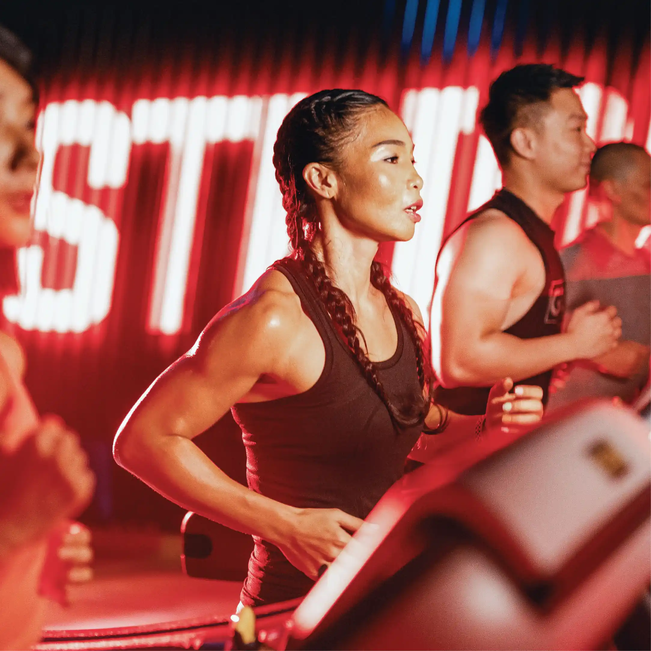 Members running on a treadmill at FireFit Studios.